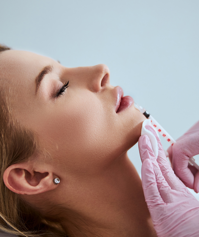 Photo of a woman receiving dermal fillers in her lip