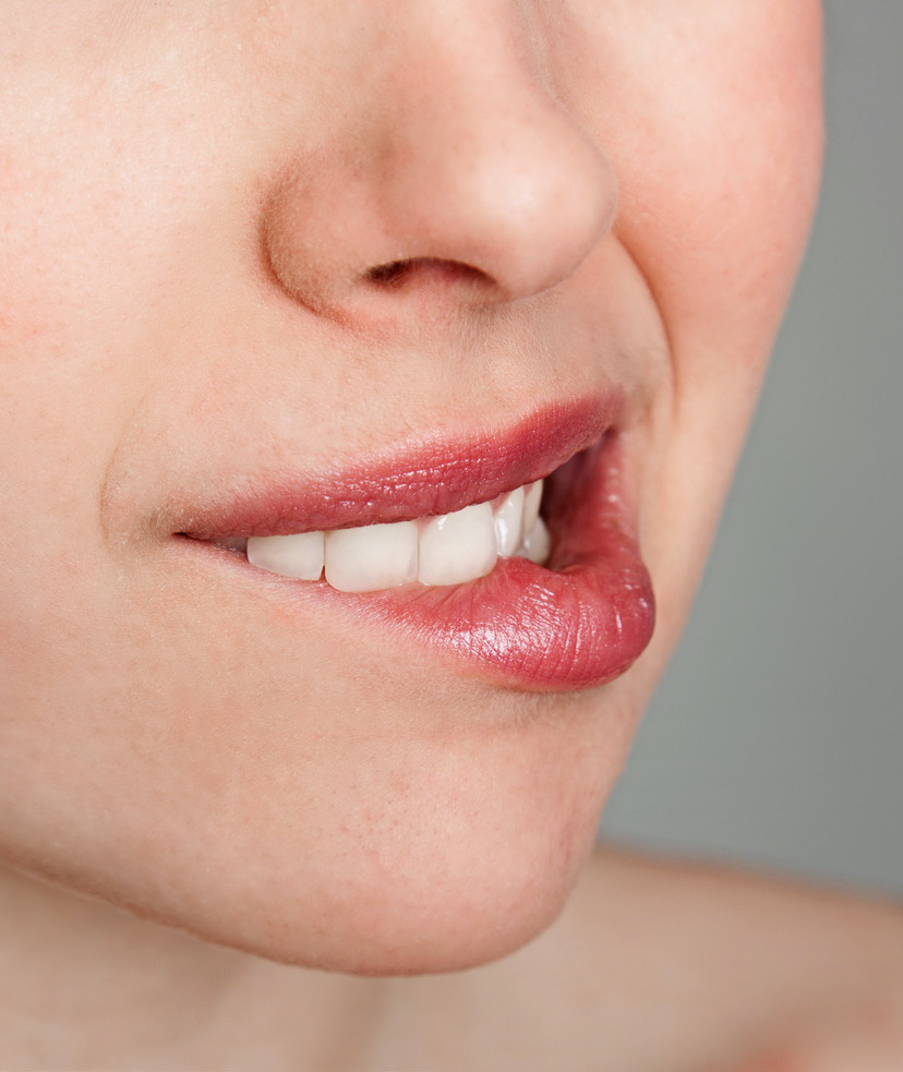 Photo of a woman biting her lip